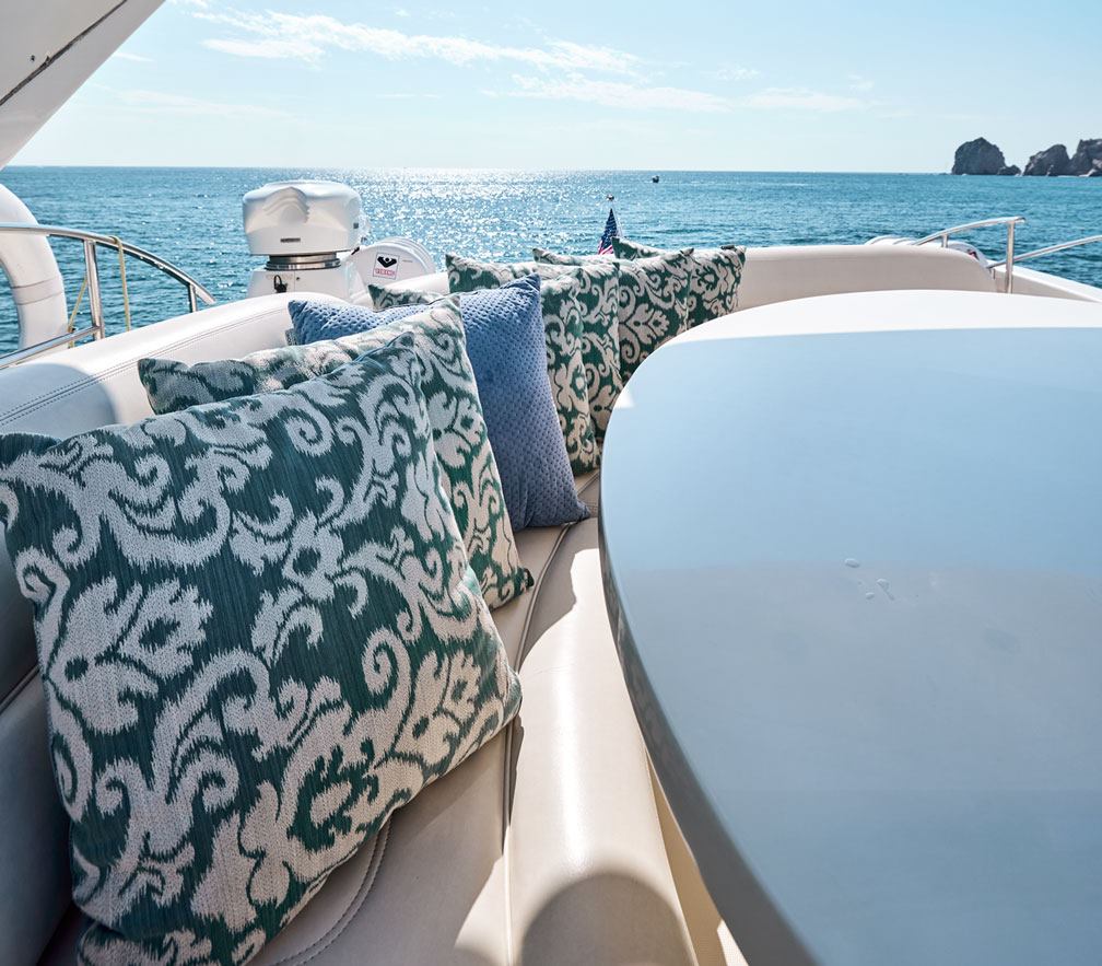 Cushioned deck seating on an 80 ft catamaran in Cabo San Lucas