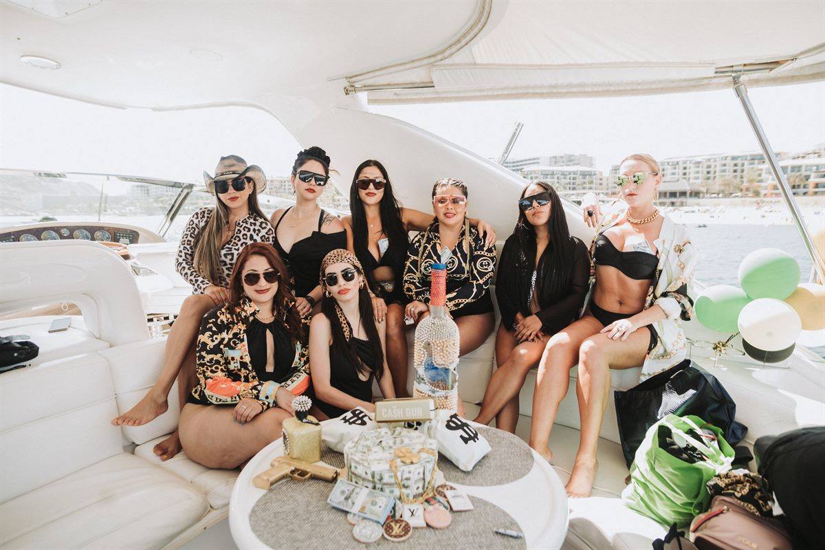 Guests relaxing on the deck of a private sunset charter in Cabo San Lucas