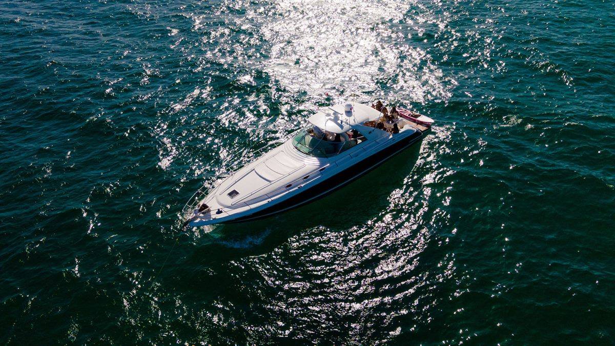 65 ft Sea Ray private yacht charter from YachtCova cruising the water off Cabo San Lucas