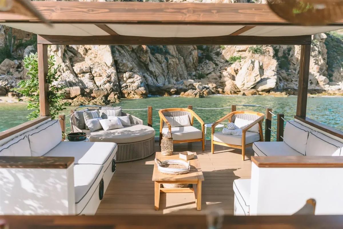 Shaded lounge deck on a private yacht charter in Cabo San Lucas